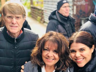 Brooke Markham has her hands on Connie Markham as Patrick Markham is right next to them.